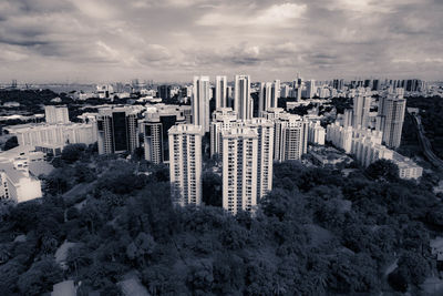 Cityscape against cloudy sky