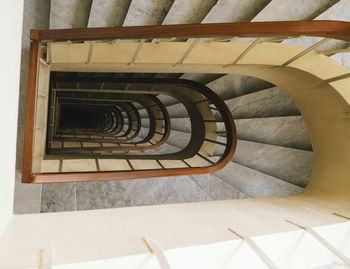 Directly below shot of spiral staircase in building