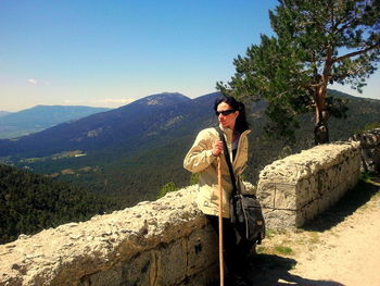 Portrait of woman standing on mountain