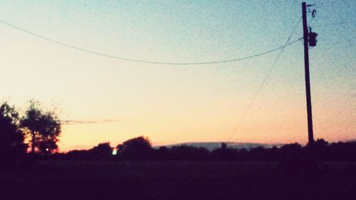 Scenic view of landscape against sky at sunset