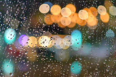 Close-up of raindrops on glass window