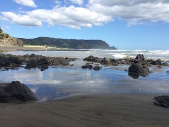 Scenic view of sea against cloudy sky