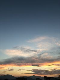 Low angle view of cloudy sky during sunset