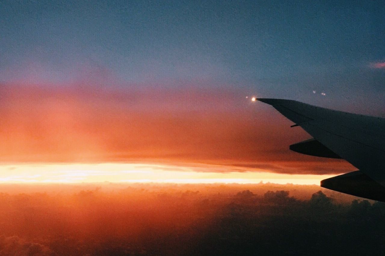 CROPPED IMAGE OF AIRPLANE FLYING IN SKY