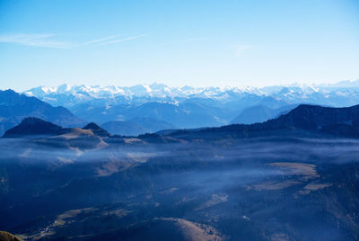 Scenic view of mountains against blue sky