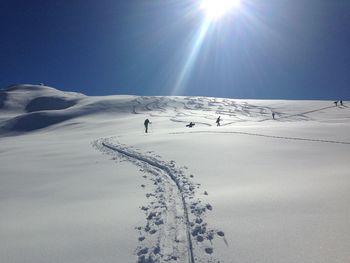 Scenic view of snow covered landscape against sky