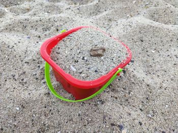 High angle view of sunglasses on sand