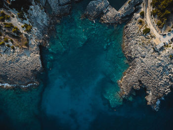 High angle view of rock formation in sea