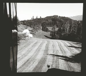 Landscape with mountain range in background