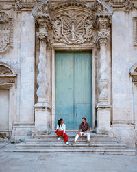 People sitting outside building