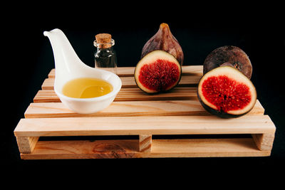 High angle view of fruits and cutting board on table