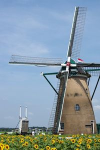 Traditional windmill against sky