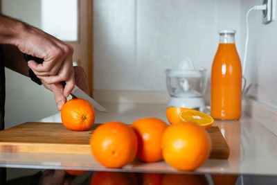 Close-up of orange tomatoes in kitchen