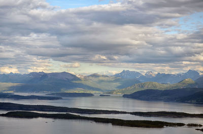 Scenic view of lake and mountains against sky