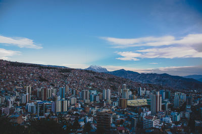 High angle view of buildings in city against sky