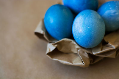 High angle view of multi colored eggs on table