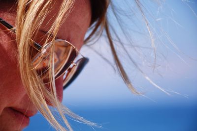 Midsection of woman against sky