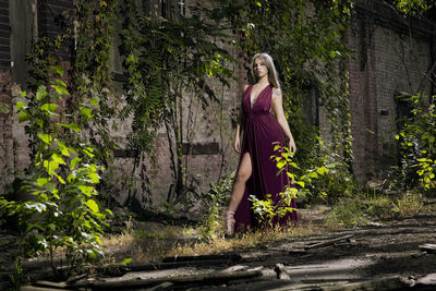 Portrait of young woman standing in abandoned shunting yard