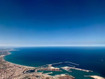 High angle view of sea against blue sky