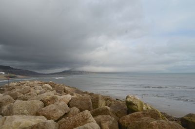 Scenic view of sea against cloudy sky