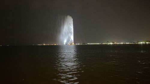 Scenic view of sea against sky at night