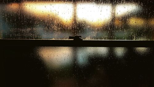 Close-up of water drops on glass window