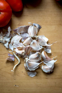 High angle view of garlic on wood