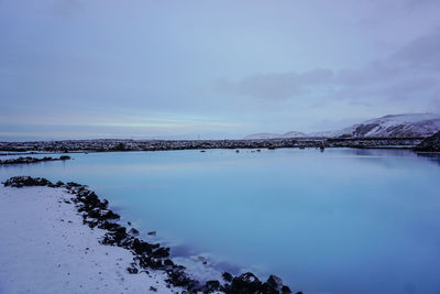 Scenic view of sea against sky during winter