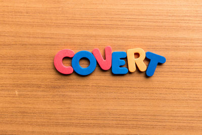 Close-up of text written on wooden table