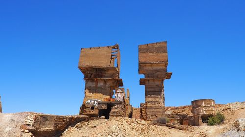 Low angle view of castle against clear blue sky