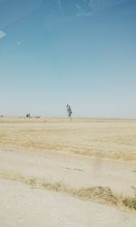 Scenic view of field against clear blue sky