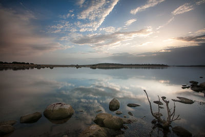 Scenic view of lake against sky during sunset