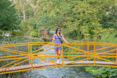 Low angle view of bridge against trees