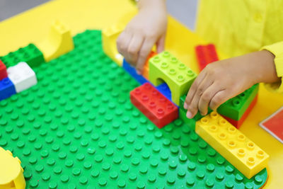 Boy playing with toy on table