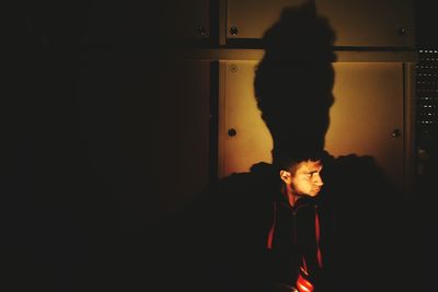 Man standing in corridor of building