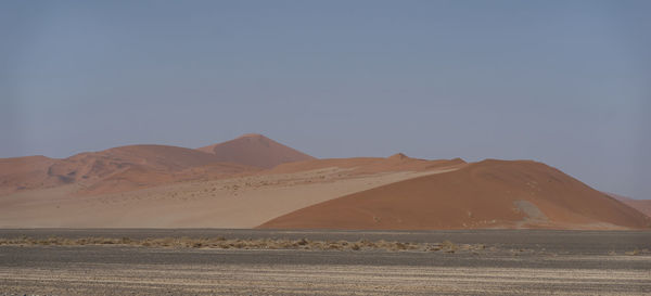 Scenic view of desert against clear sky