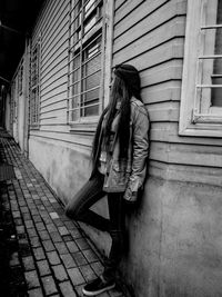 Woman with umbrella in city