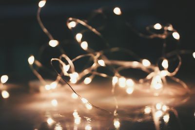 Close-up of illuminated lights at night