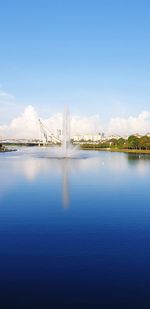 Bridge over river against blue sky