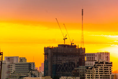 Buildings against sky during sunset