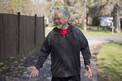 Full length of man standing against tree