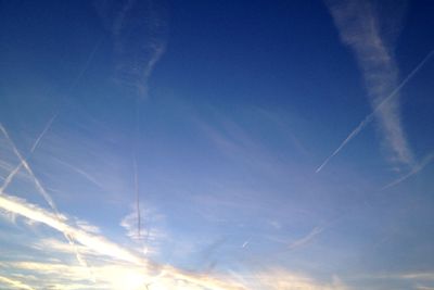 Low angle view of vapor trails in sky