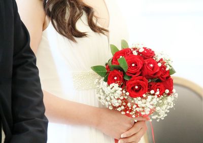 Close-up of woman holding bouquet