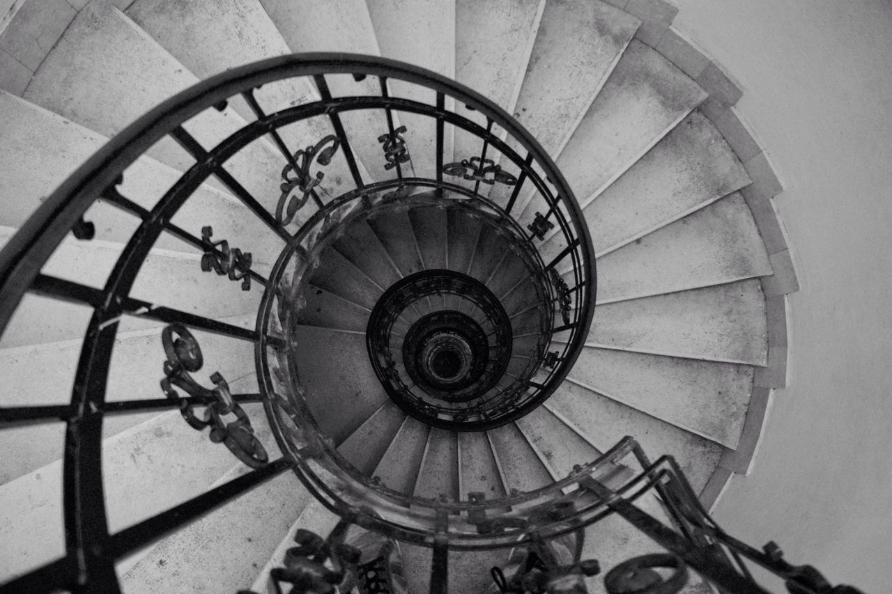 LOW ANGLE VIEW OF SPIRAL STAIRS