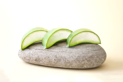 Close-up of green beans against white background