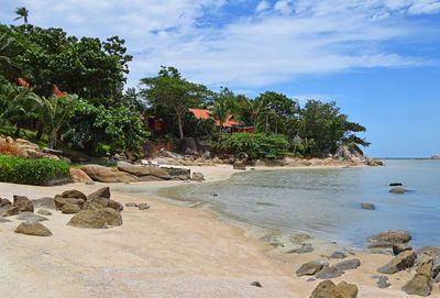 Scenic view of calm sea against cloudy sky