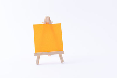 Close-up of yellow toy against white background