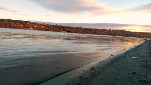 Scenic view of beach against sky during sunset