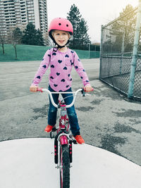 Girl riding bicycle in court