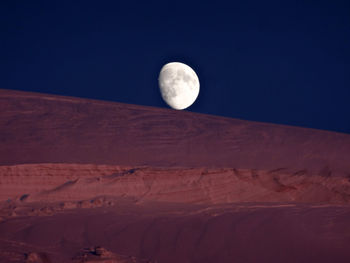 Low angle view of half moon in sky